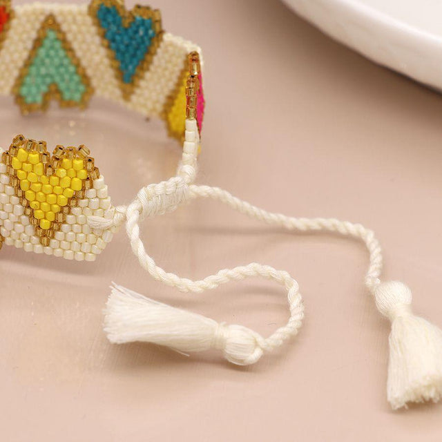Pom Boutique White and Multi Colour Hearts Beaded Bracelet Tassel Fastening
