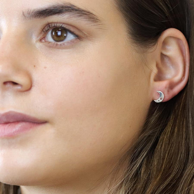 Silver Moon With Star Cut Out Stud Earrings on Model