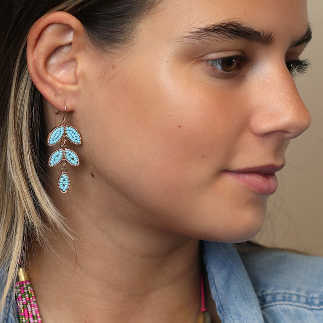 Pom Butique Turquoise Beaded Leaf Earrings on Model