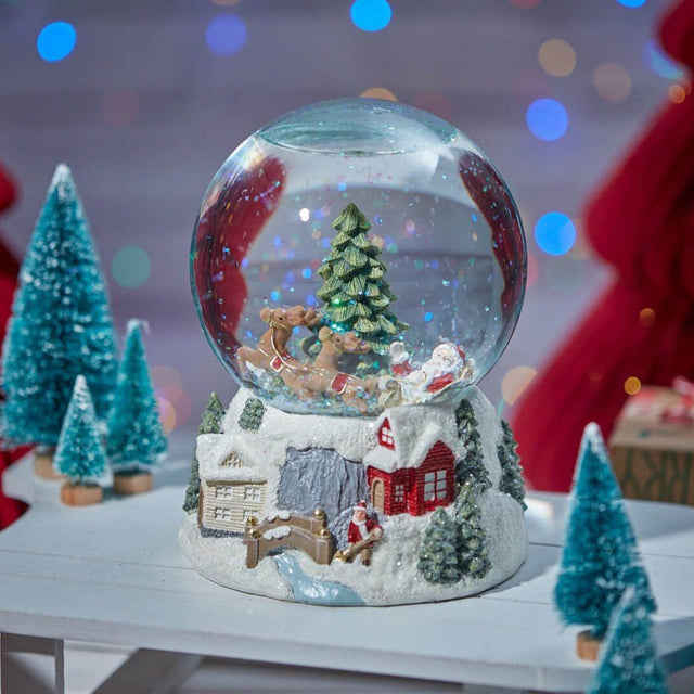 Santa on Sleigh and Winter Village Scene Snowglobe