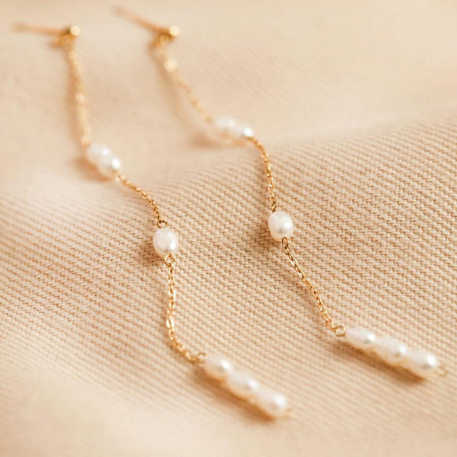 Stainless Steel Pearl Dangly Earrings in Gold