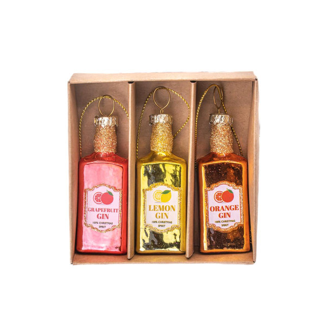 Sass and Belle Three miniature gin bottles in a box labeled 'Grapefruit Gin', 'Lemon Gin', and 'Orange Gin'.