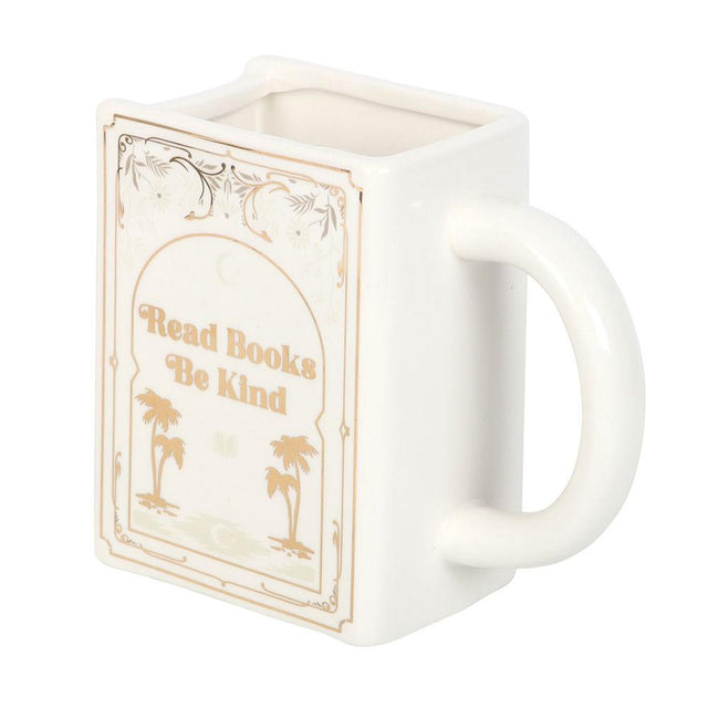 White mug with book design and 'Read Books Be Kind' text on a white background