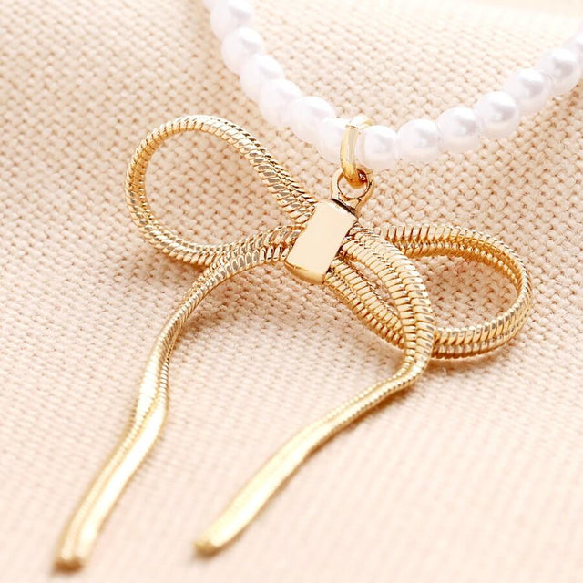 Pearl Bow Necklace in Gold 3