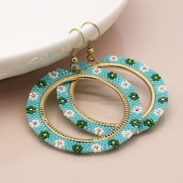 Pom Boutique Aqua Beaded Circle Earrings with Flowers Close Up View