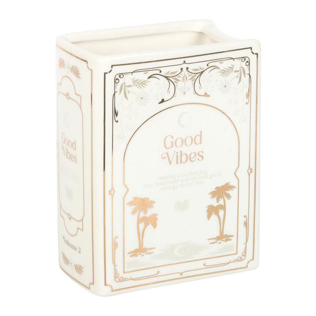 Decorative vase with 'Good Vibes' text and palm tree designs on a white background